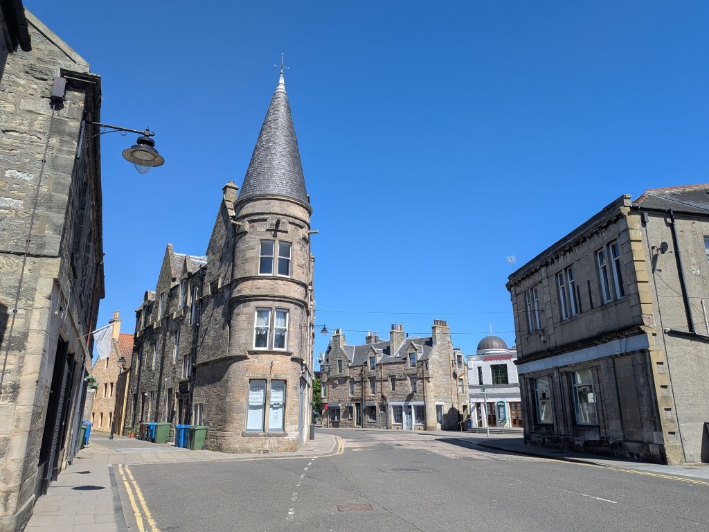 Historic town centre against a blue sky.