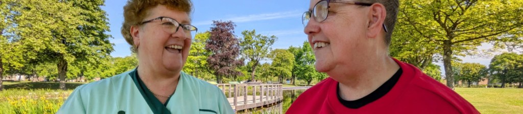 Carer and client in Zetland Park.